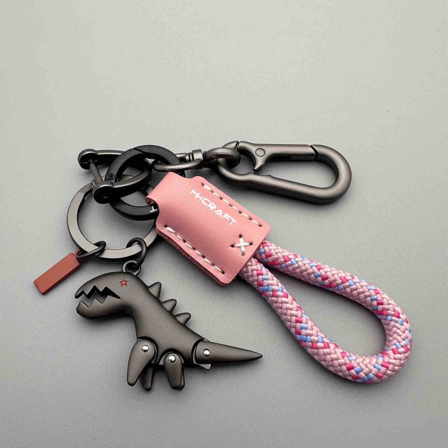Aluminum Alloy Dinosaur Charm Paired with a Hand-woven Braceletš„